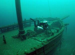 A diver swims over the two masted schooner, Walter B. Allen. Tamara Thomsen, Wisconsin Historical Society